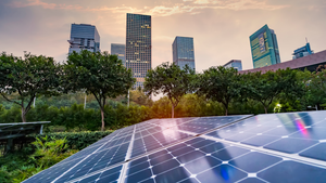 Solar panels with sky scrapers in the background