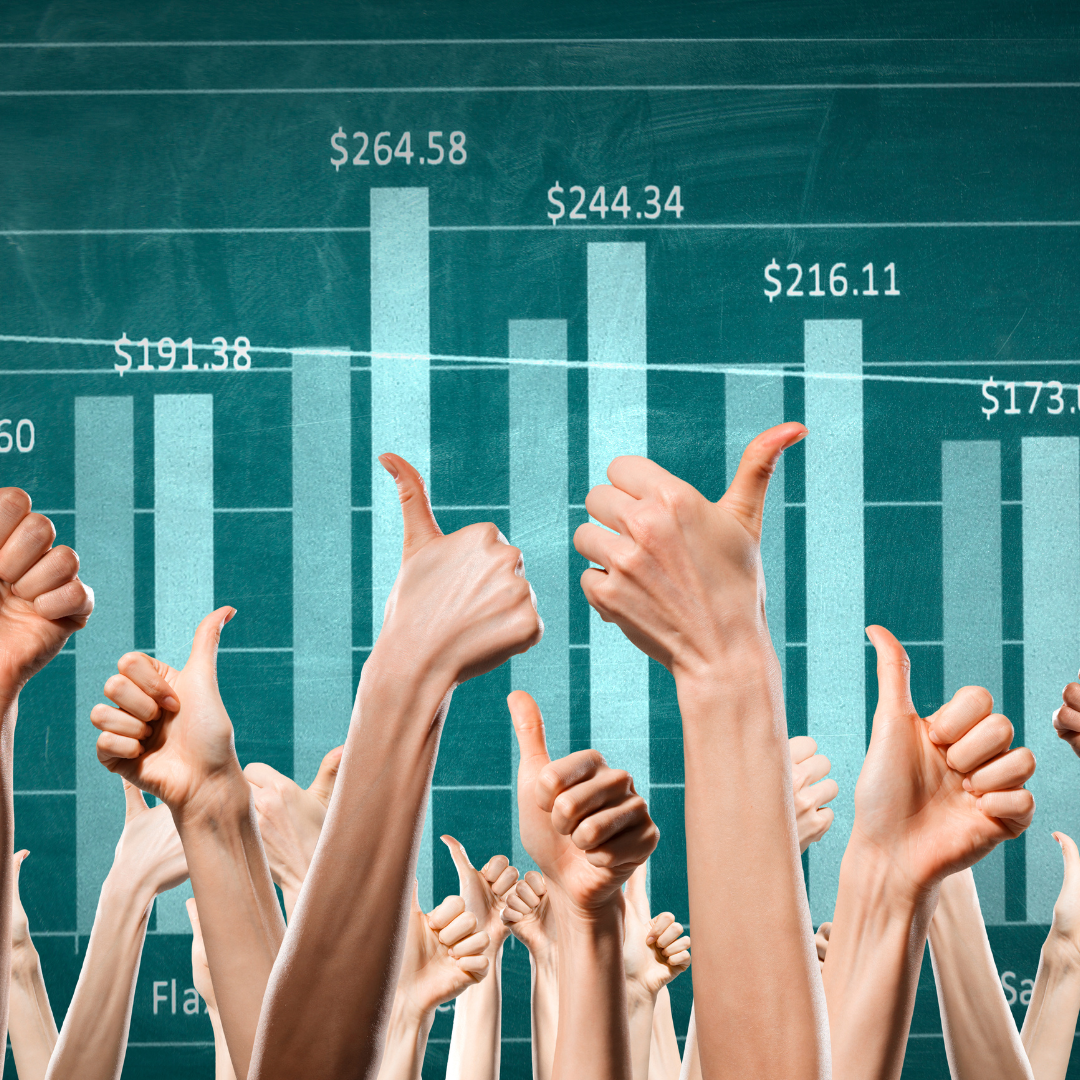 A picture of a group of hands showing thumbs up and graphs with figures in the background