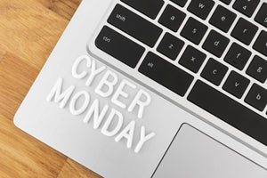 Cyber Monday written on the corner of a laptop using plastic white letters. 