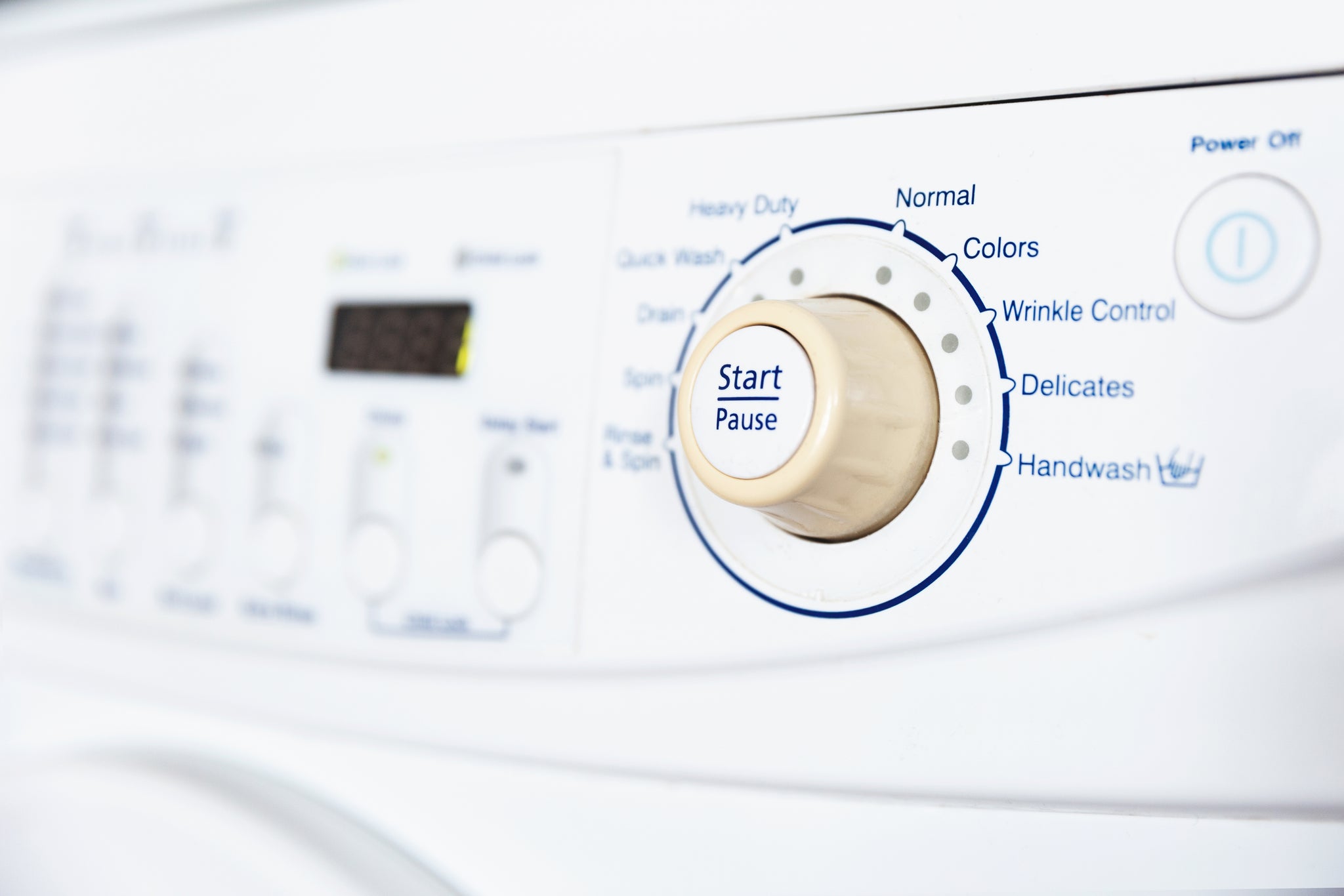 Regulation/mode changing switch on a washing machine. 